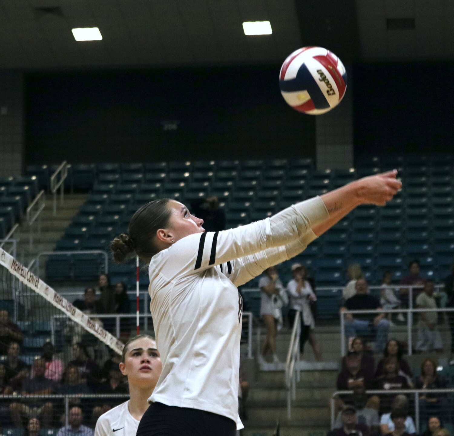 Makenna Loo digs a ball during Tuesday’s match between Cinco Ranch and Cy-Fair at the Merrell Center.