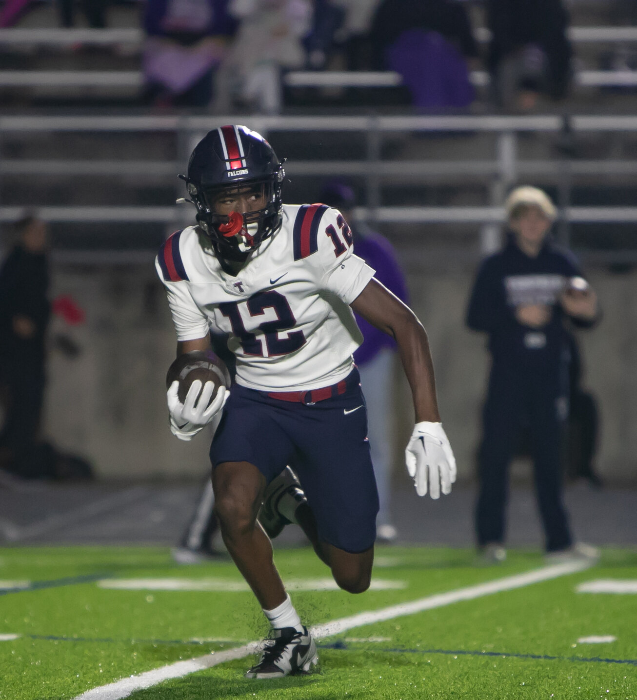 KJ Madison cuts upfield after catching a pass during Friday's game between Tompkins and Ridge Point at Hall Stadium.