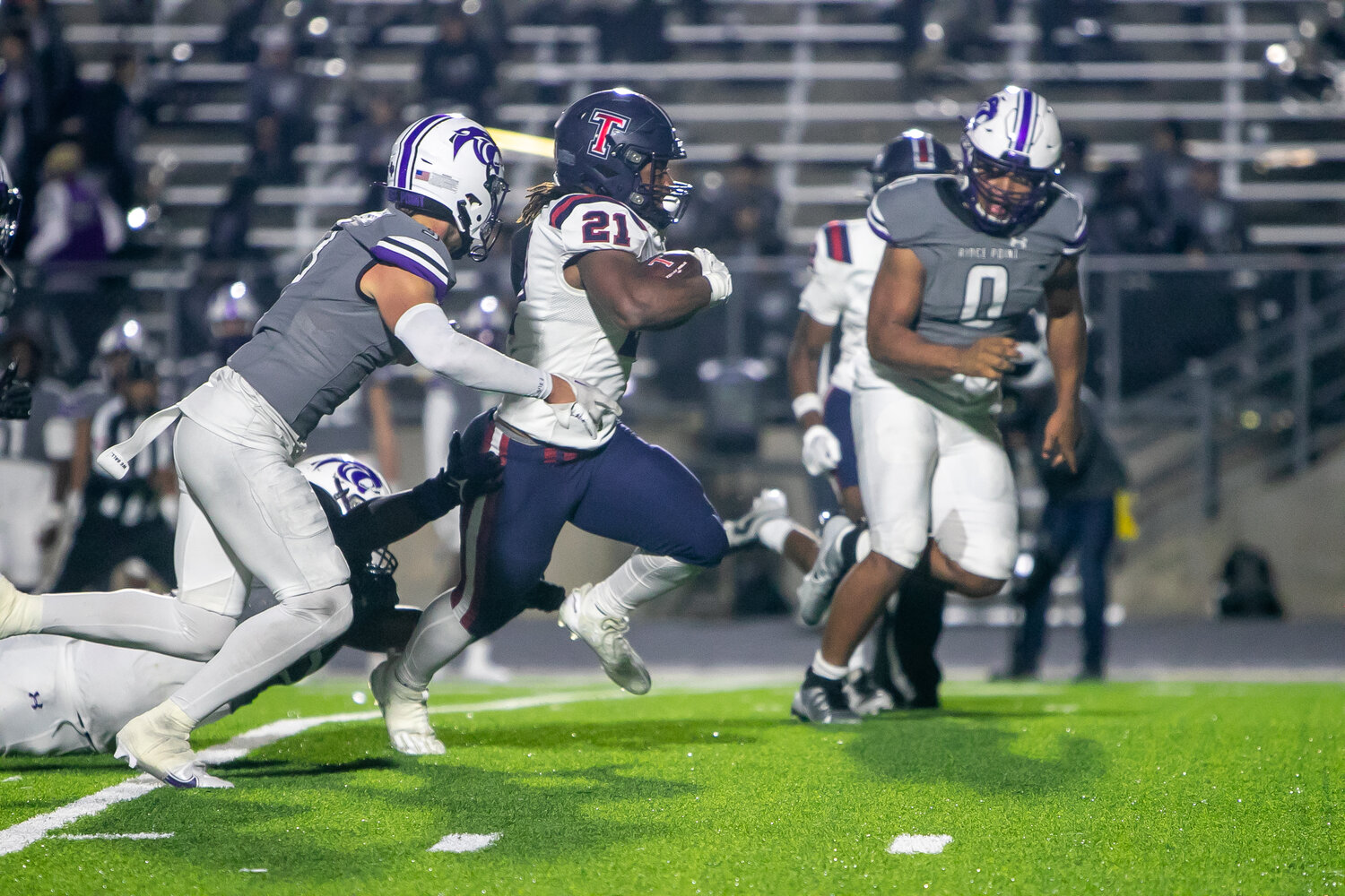 Caleb Blocker races past defenders during Friday's game between Tompkins and Ridge Point at Hall Stadium.