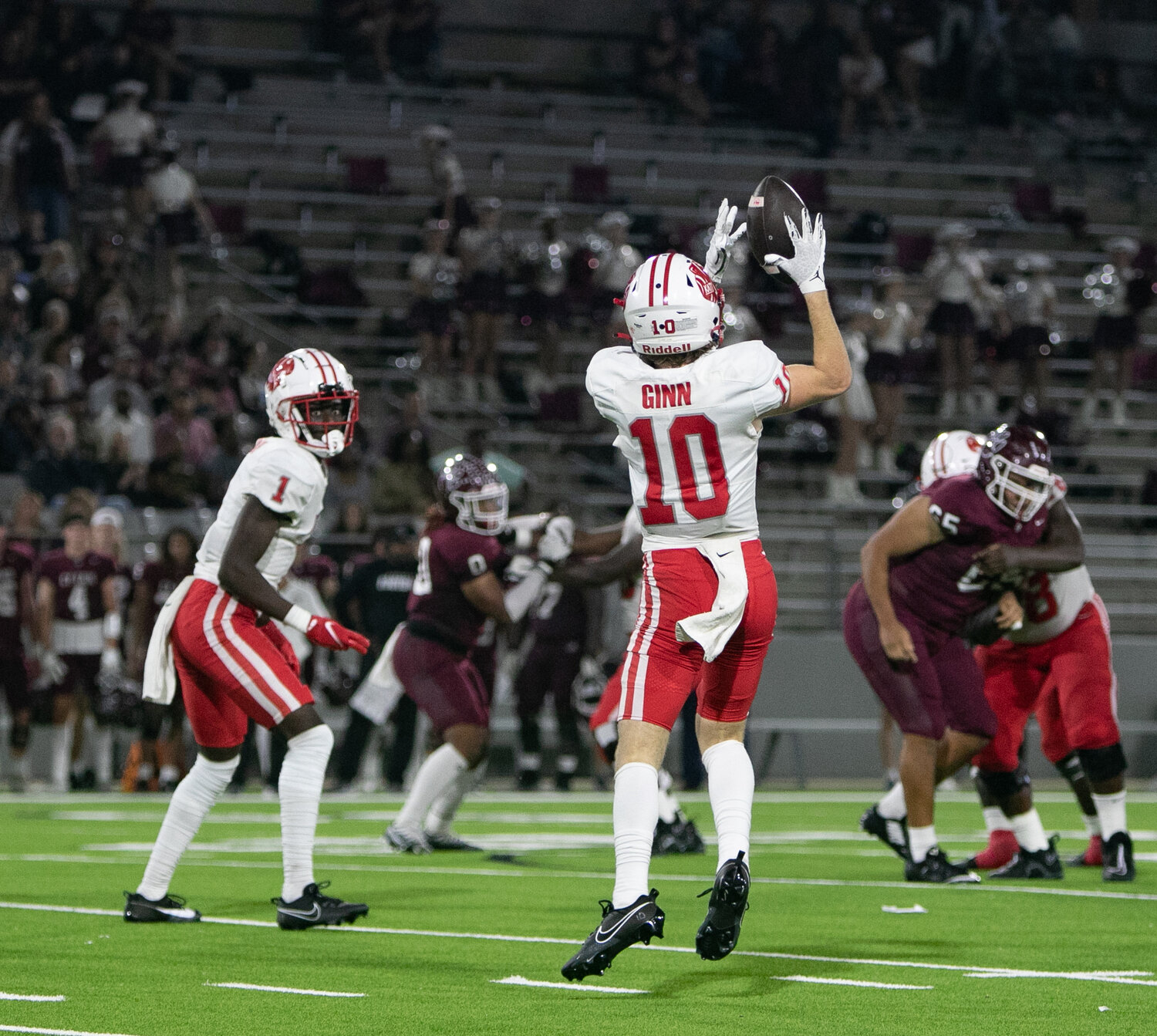 Oliver Ginn catches a pass during Friday's area round game between Katy and Cy-Fair at the Berry Center in Cypress.