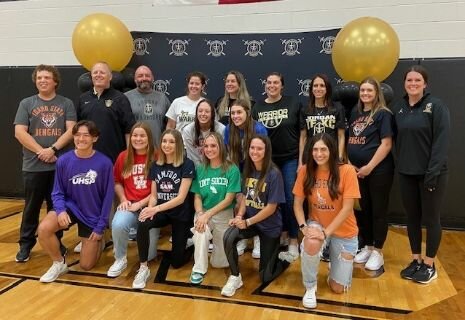 Jordan student athletes pose for a photo on national signing day.