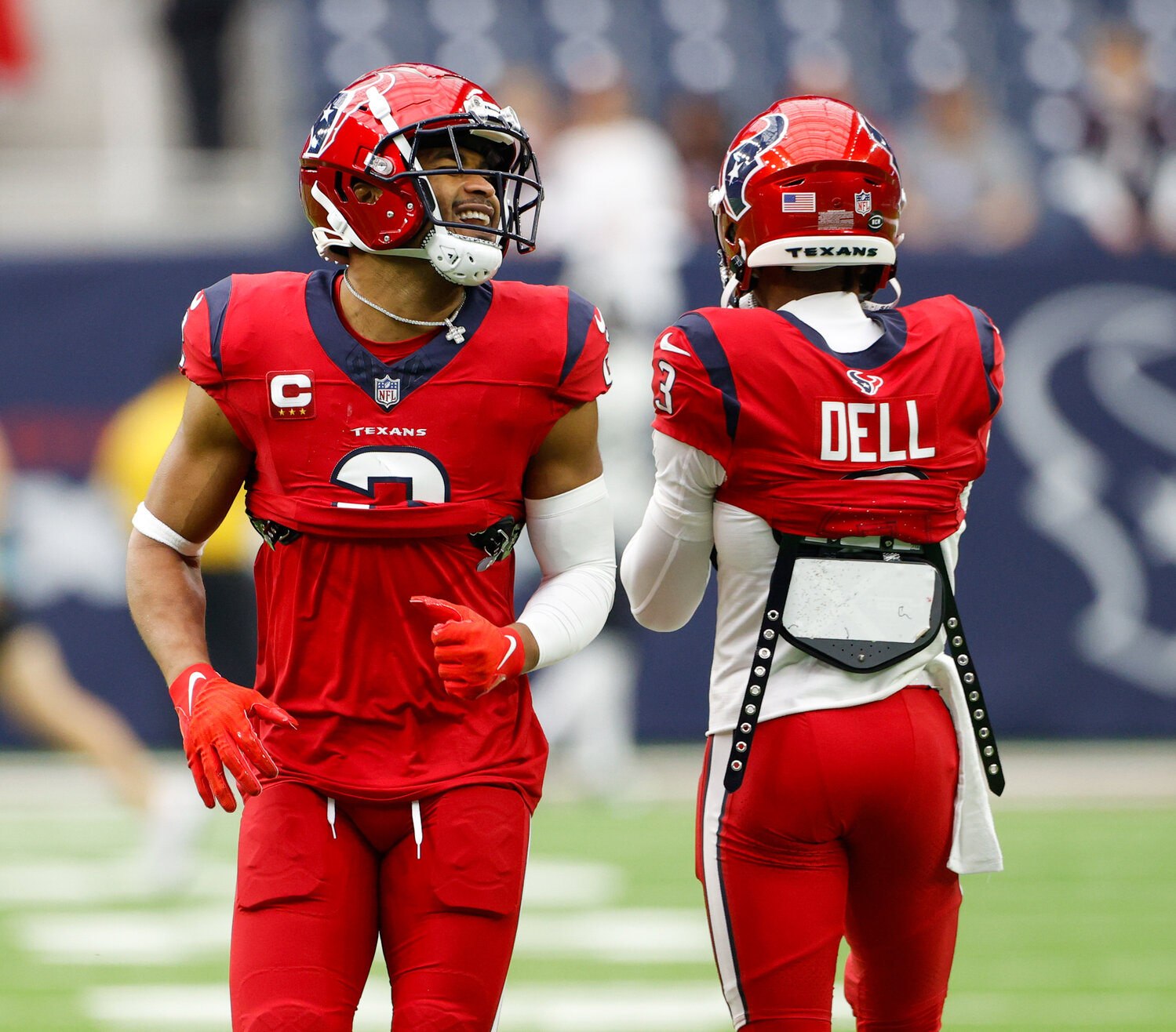 Texans wide receiver Robert Woods (2) shares a laugh with wide receiver Tank Dell (3) during warmups before an NFL game between the Texans and the Jaguars on November 26, 2023, in Houston.