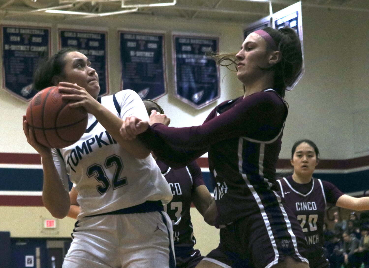 Rihanna DeLeon fights through contact to shoot a layup during Tuesday's game between Tompkins and Cinco Ranch at the Tompkins gym.