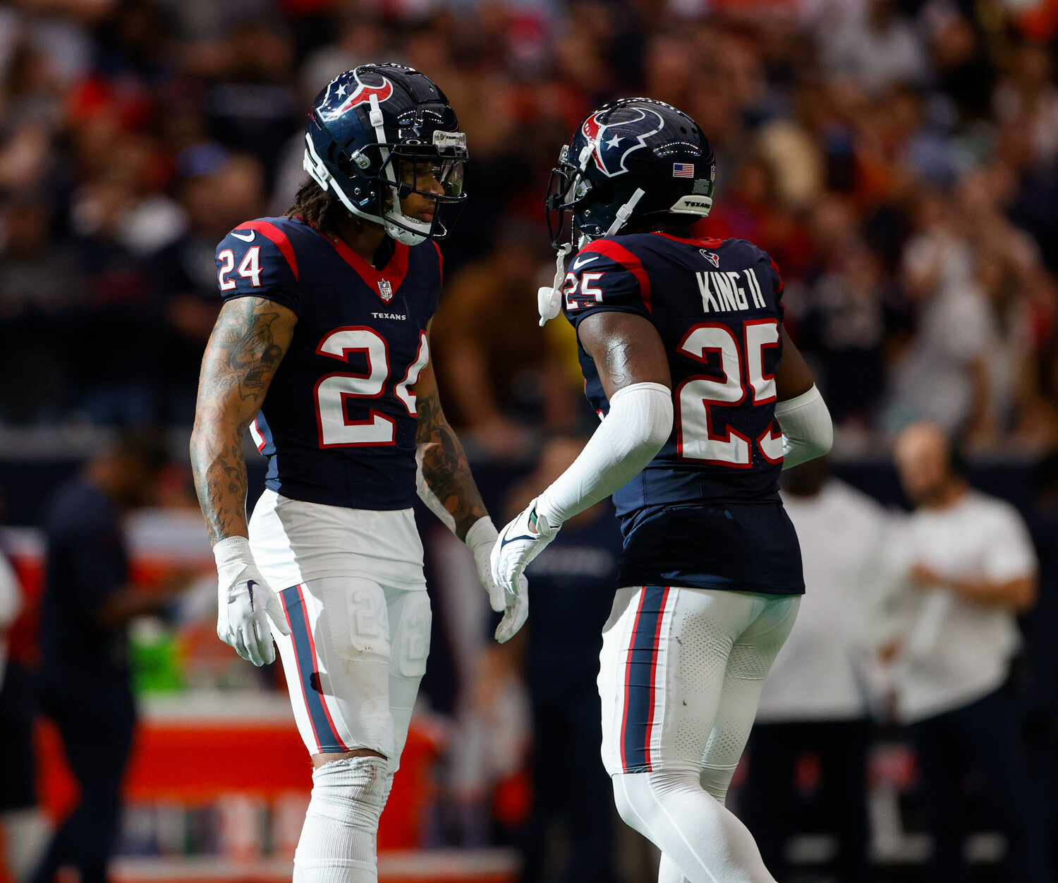Texans cornerback Derek Stingley Jr. (24) and cornerback Desmond King II (25) between plays in an NFL game between the Texans and the Broncos on December 3, 2023 in Houston. The Texans won, 22-17.