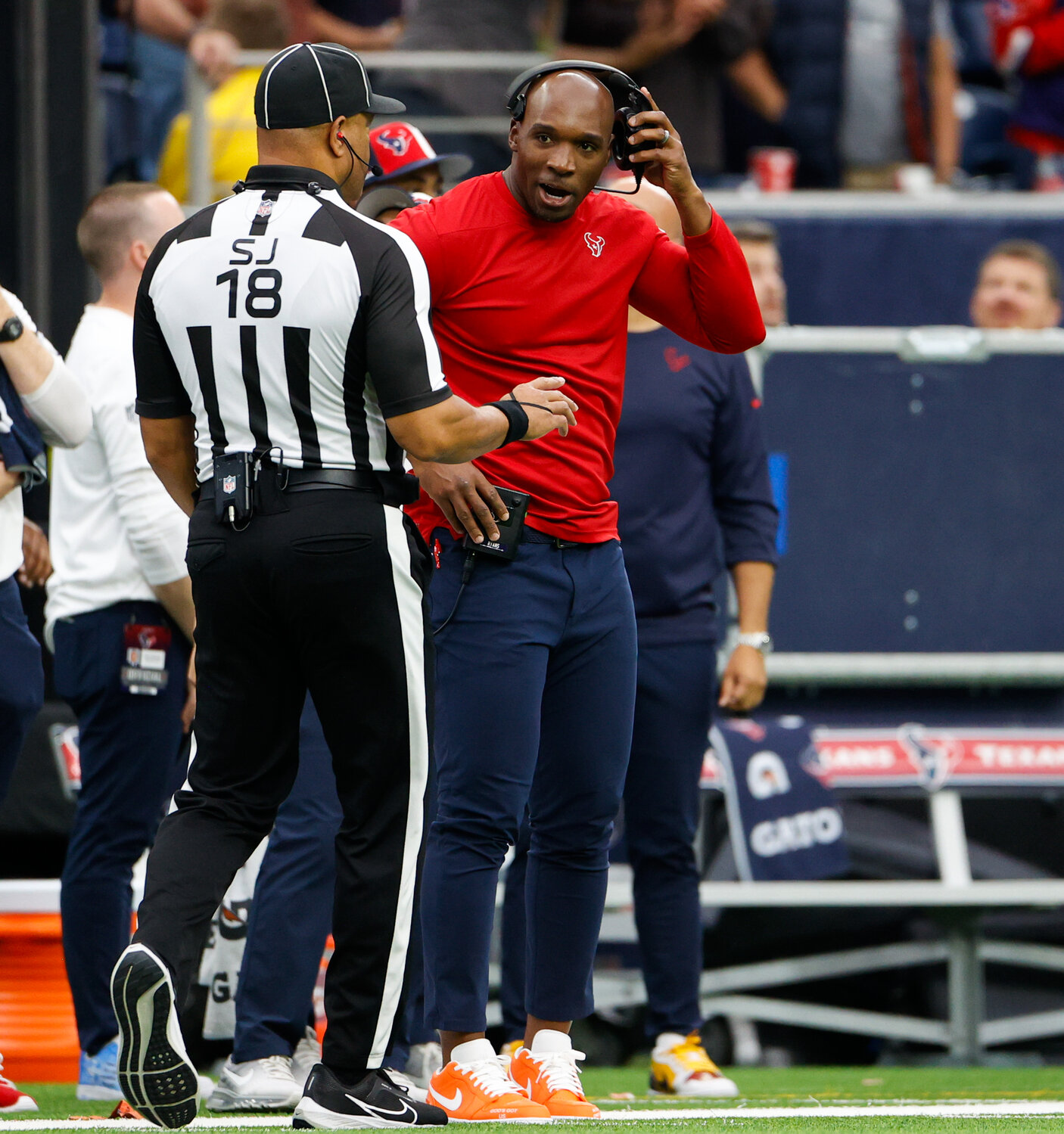 Texans head coach DeMeco Ryans discusses a play with side judge Clay Reynard (18) during an NFL game between the Texans and the Broncos on December 3, 2023 in Houston. The Texans won, 22-17.