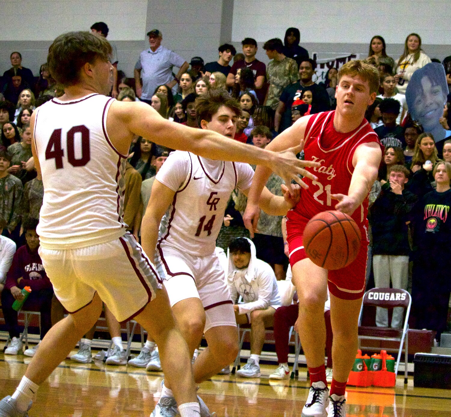 Brady Willis passes the ball along the baseline during Wednesday’s game between Katy and Cinco Ranch at the Cinco Ranch gym.