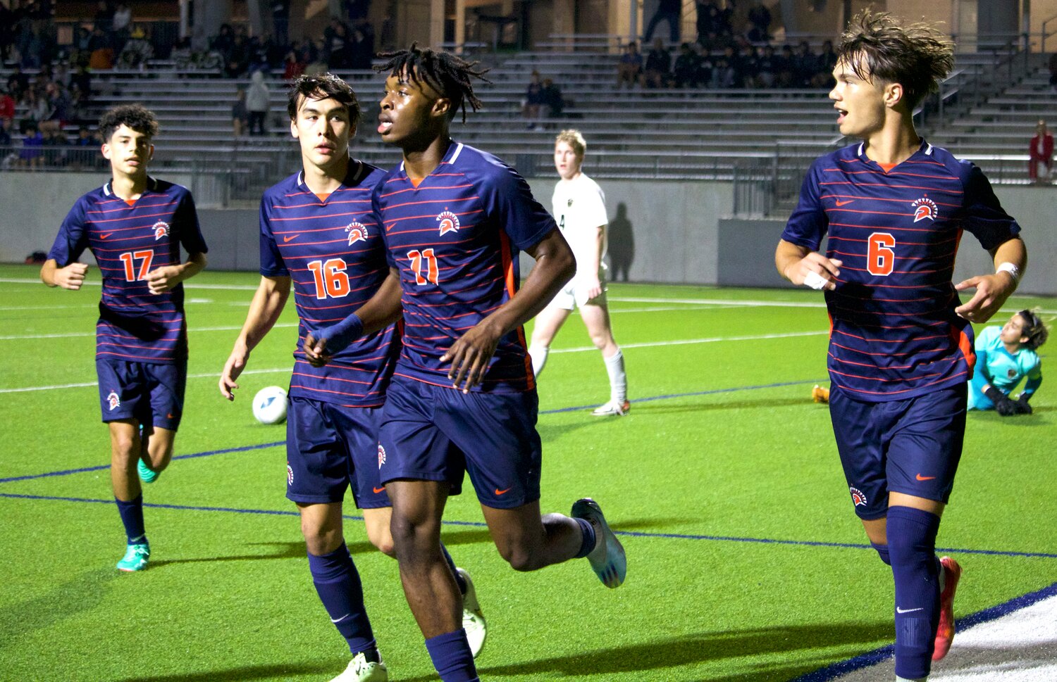 Seven Lakes players run towards the corner flag after Kortay Koc scored a goal during Friday’s game between Seven Lakes and Jordan at Legacy Stadium.