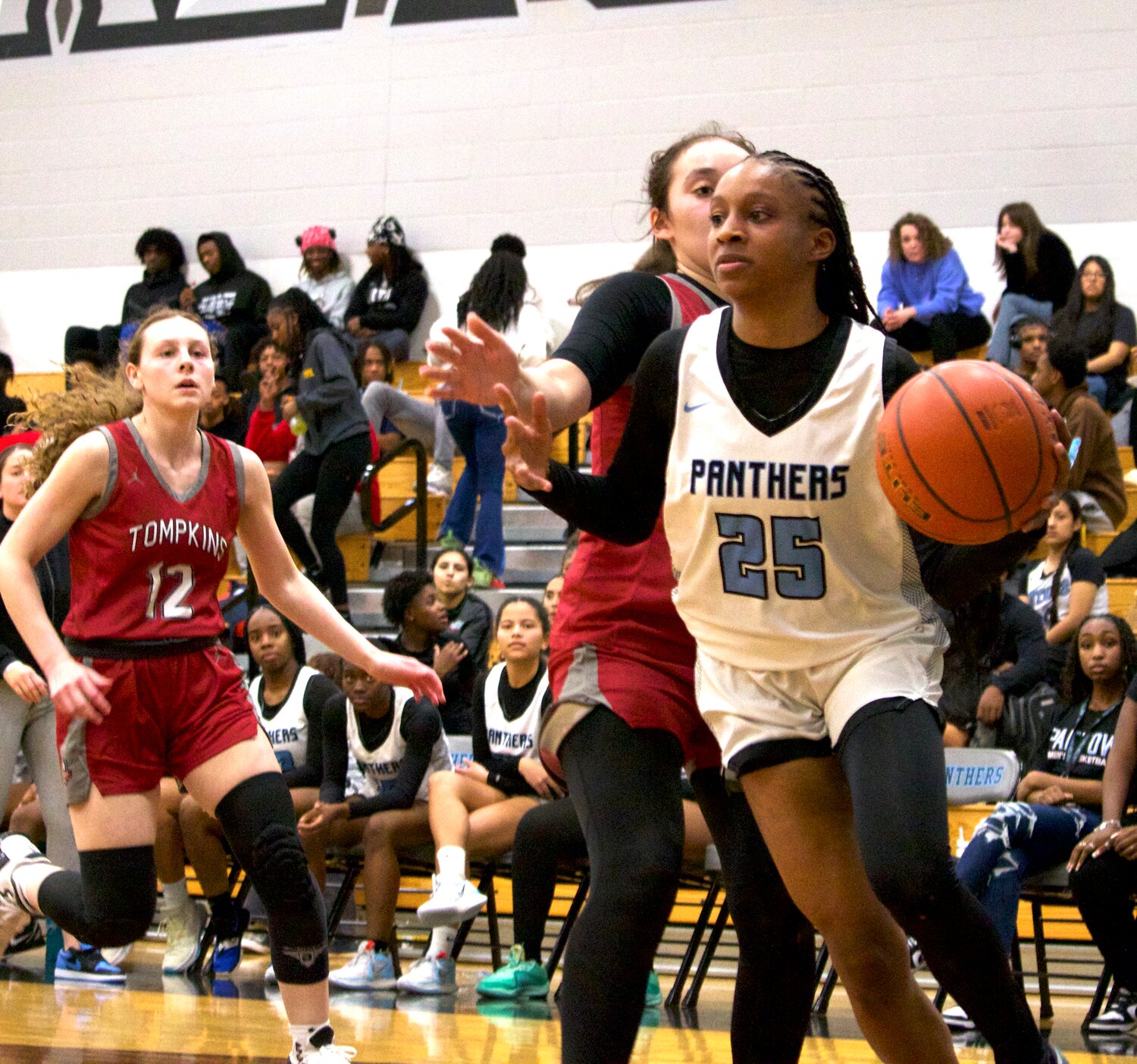 Tiera Hall drives to the basket during Tuesday’s game between Tompkins and Paetow at the Paetow gym.